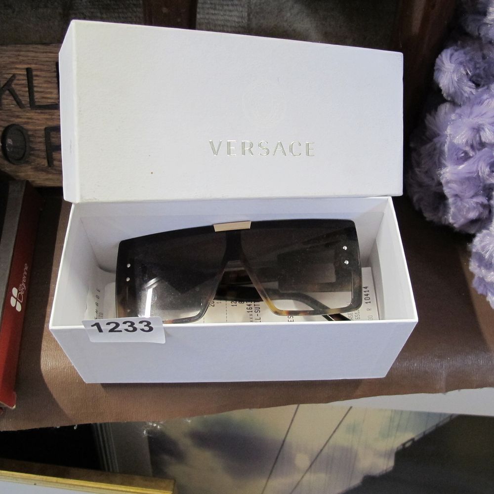 Lot 1233: A Pair of Versace Shield Sunglasses