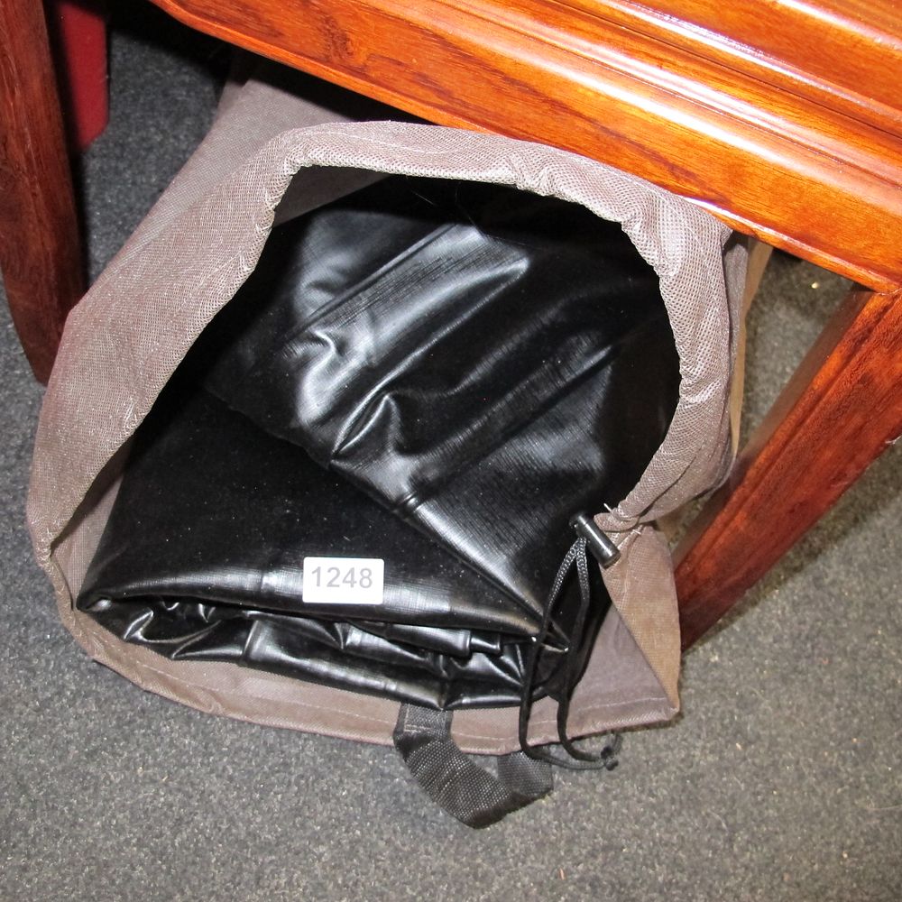 Lot 1248: Heavy-Duty Black Waterproof Equipment Cover in Storage Bag