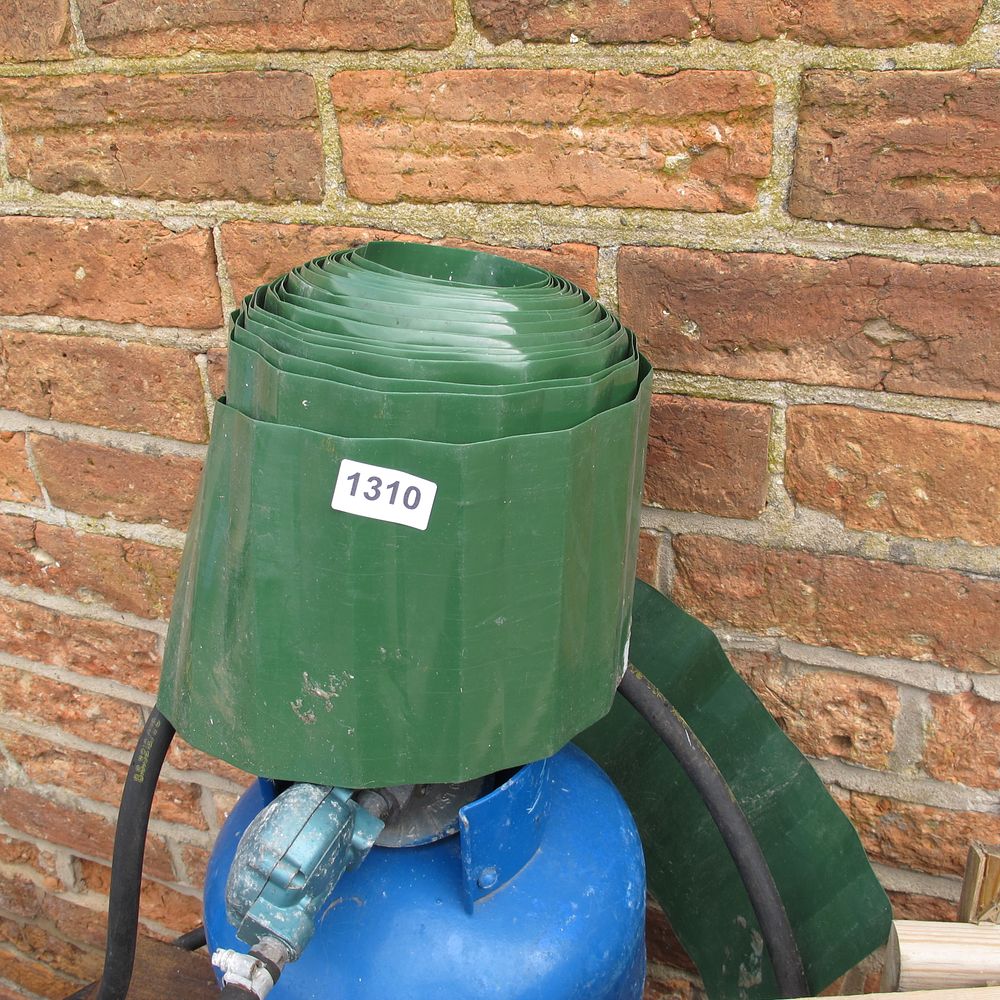 Lot 1310: A roll of green corrugated garden edging together...