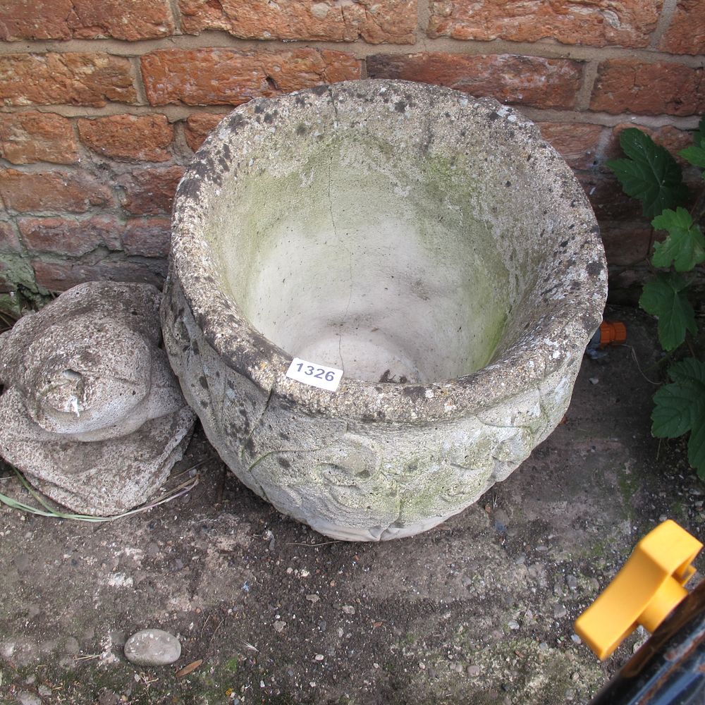 Lot 1326: A Weathered Composition Stone Garden Urn with Foliate...
