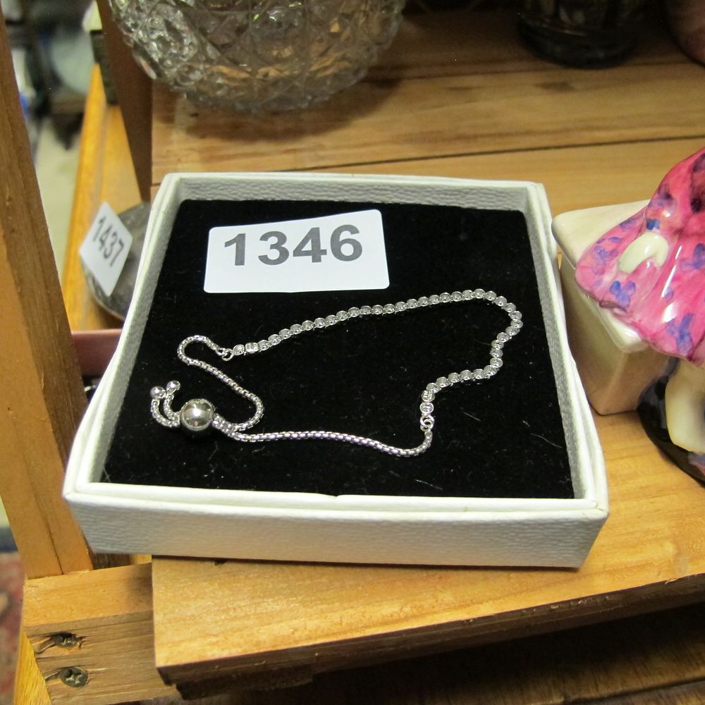 Lot 1346: A White Metal Adjustable Slider Tennis Bracelet