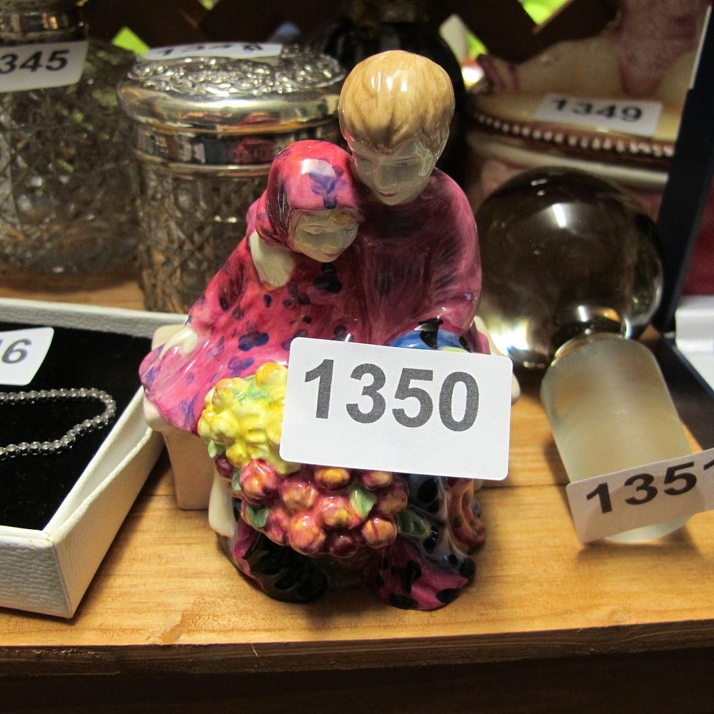 Lot 1350: A Royal Doulton style polychrome porcelain figurine titled...