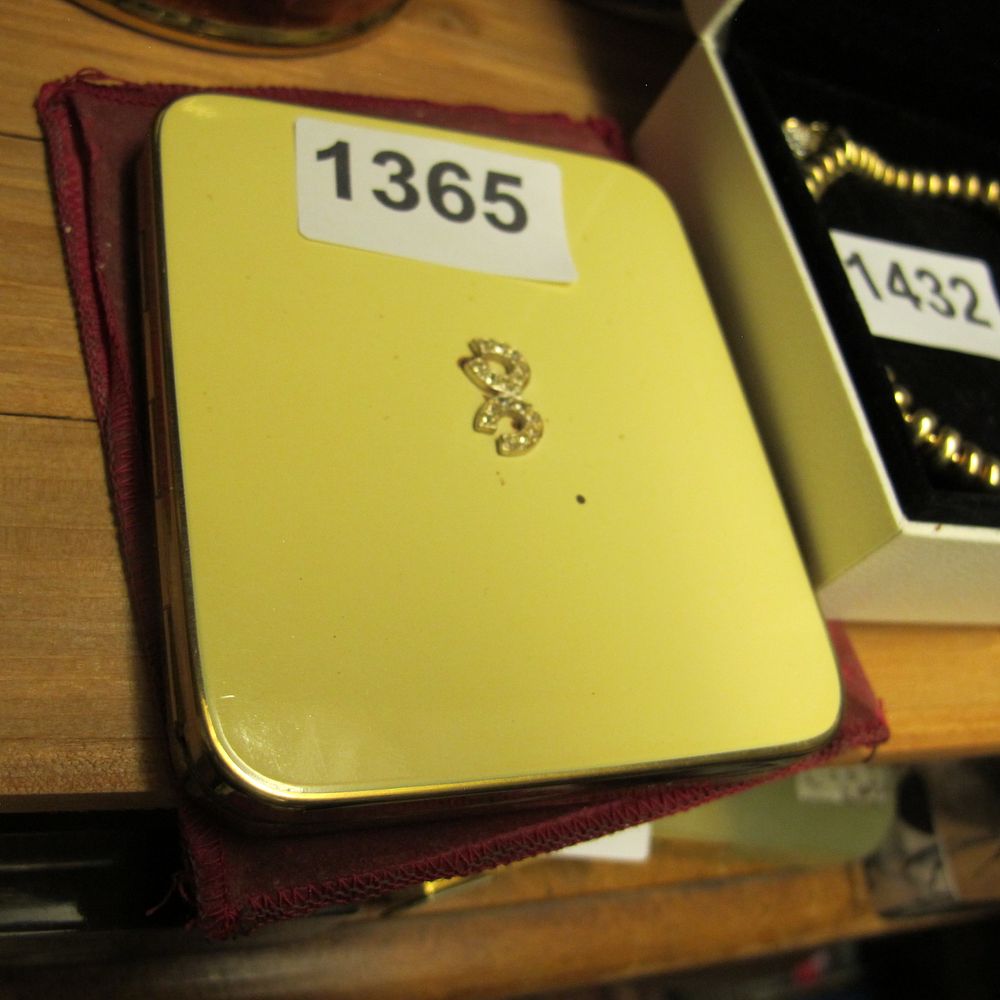 Lot 1365: Mid-Century Yellow Enameled Gold-Toned Compact Case Attributed to...