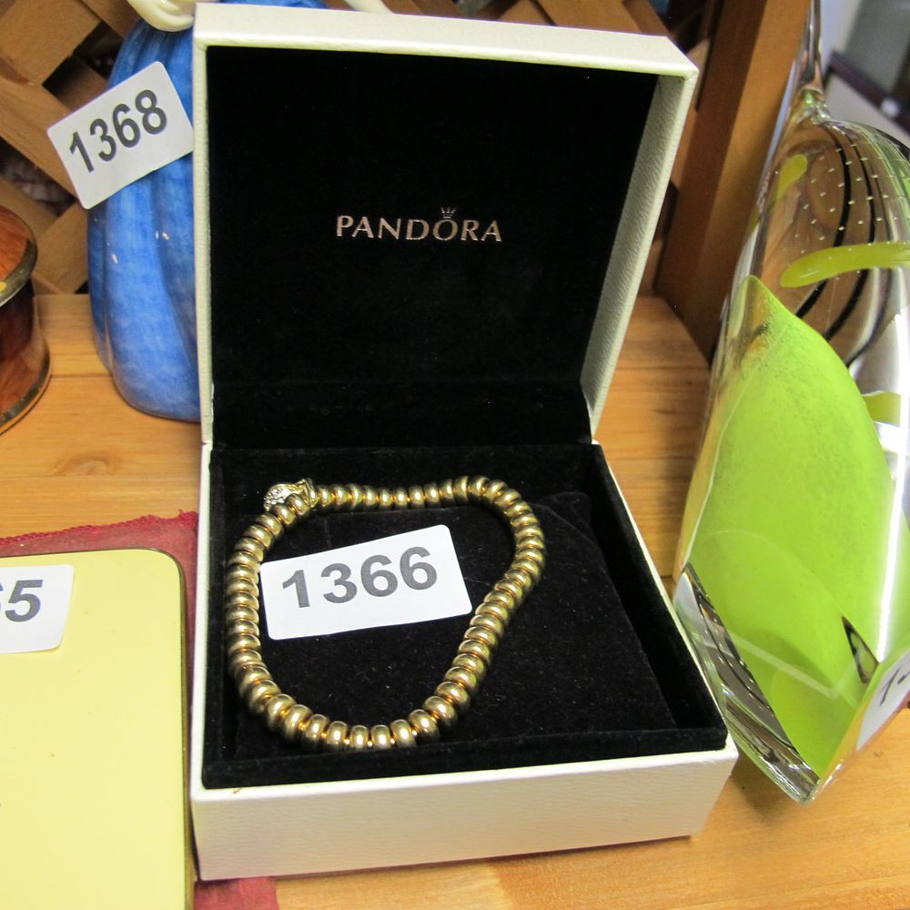 Lot 1366: A Pandora Gold-Plated Beads and Pavé Bracelet