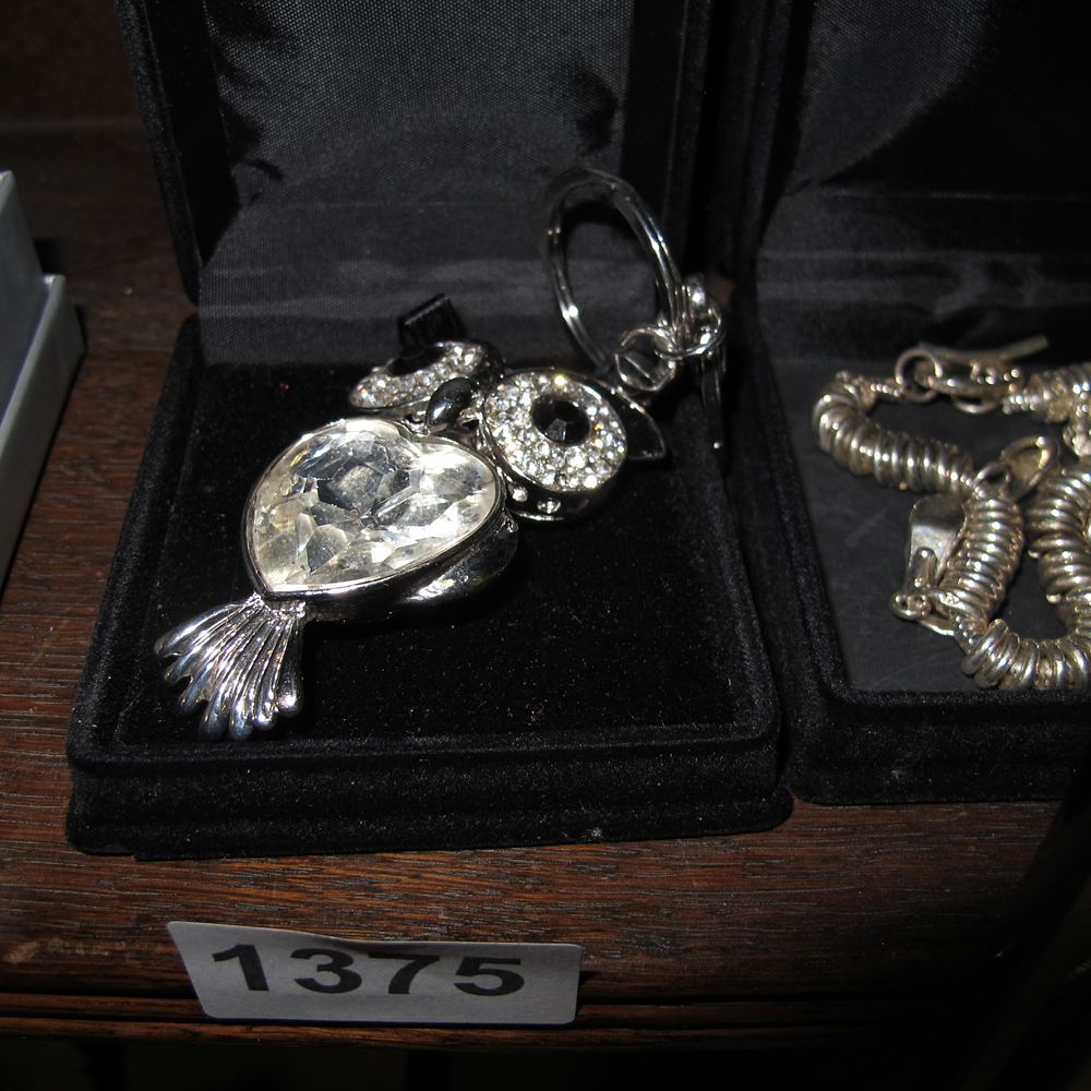 Lot 1375: Two Pieces of Silver-Tone Costume Jewellery and Accessories...