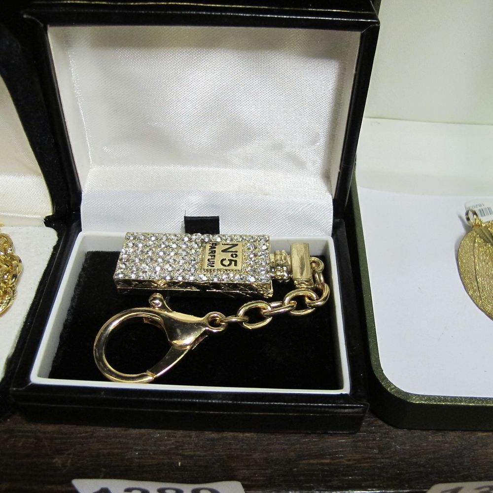 Lot 1380: A Gold-tone and Rhinestone Perfume Bottle Design Bag...