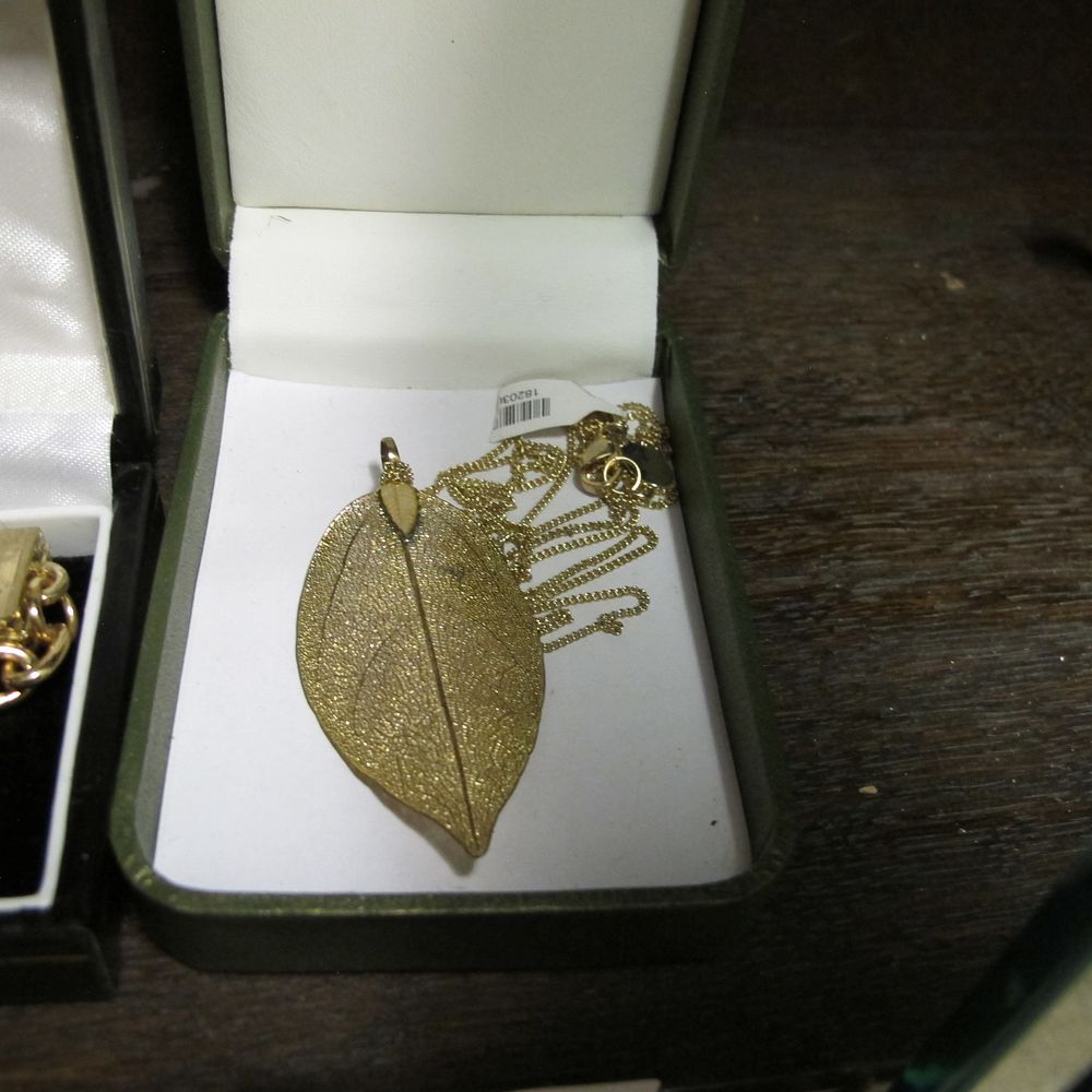 Lot 1381: A Yellow Metal Skeletal Leaf Pendant Necklace