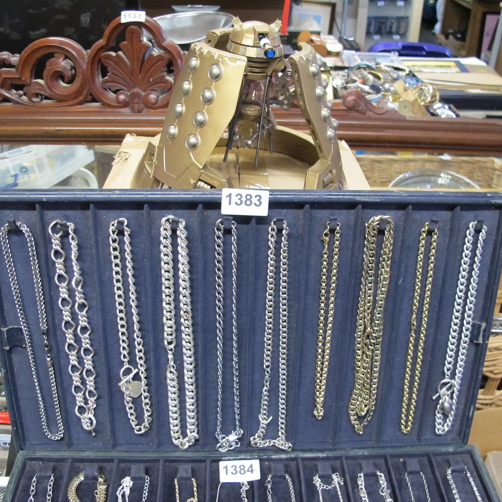 Lot 1383: An Assortment of White and Yellow Metal Necklaces...