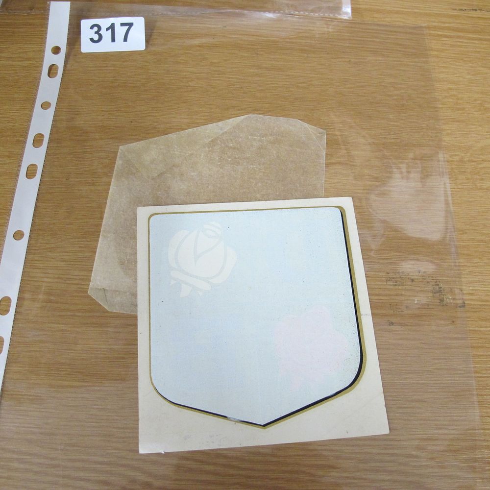Lot 317: A Heraldic Shield-Shaped Decal Featuring Rose Motifs