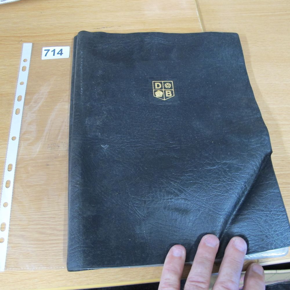 Lot 714: A Grained Black Vinyl Binder with Gilt Emblem