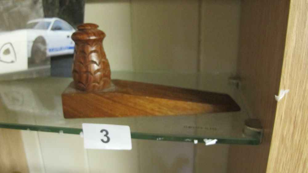 Lot 3: A Hand Carved Hardwood Wedge Doorstop with Stylised Handle