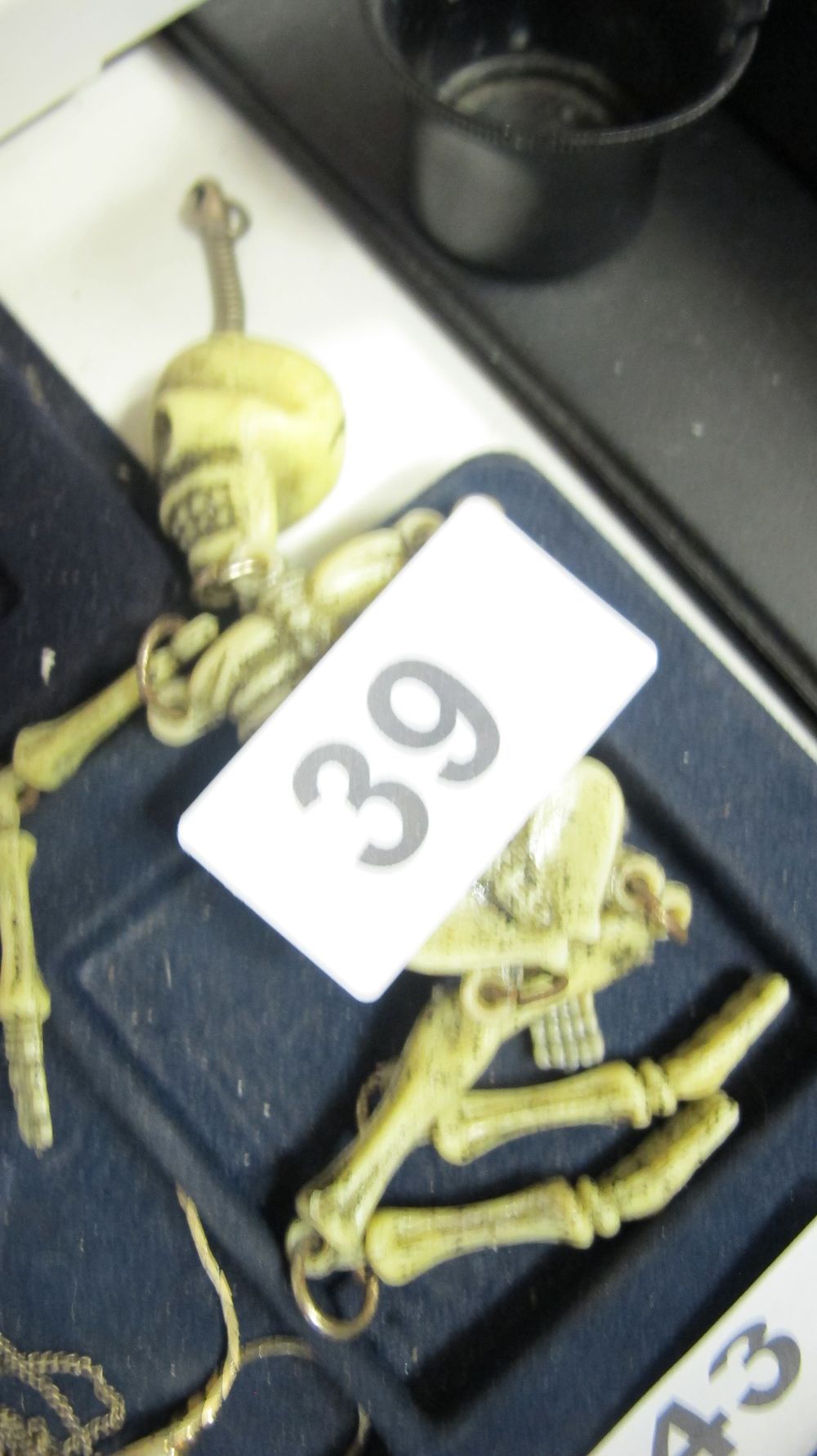 Lot 39: Articulated Plastic Skeleton Charm