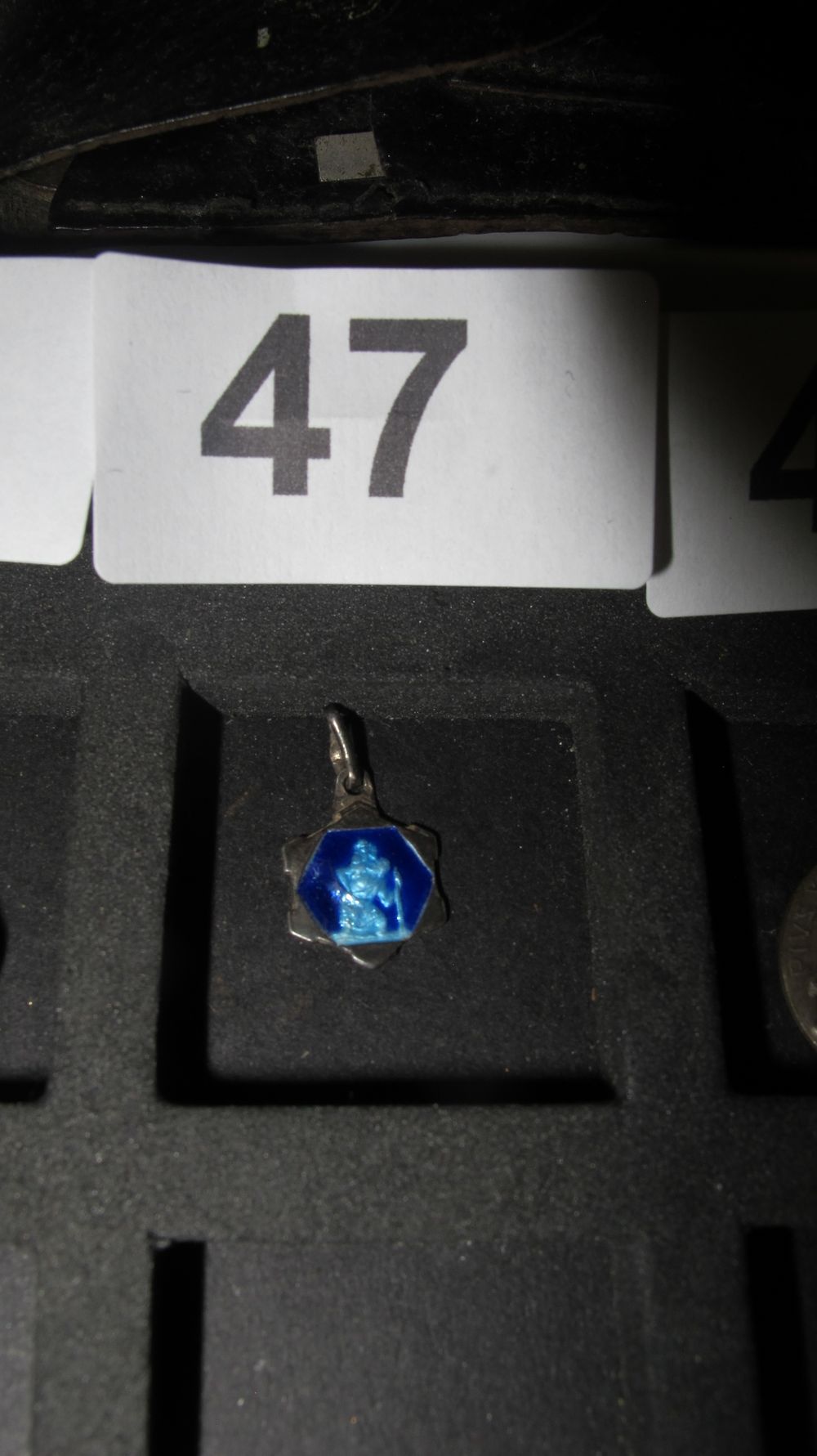 Lot 47: Blue Enamel and White Metal Hexagonal Religious Pendant Charm