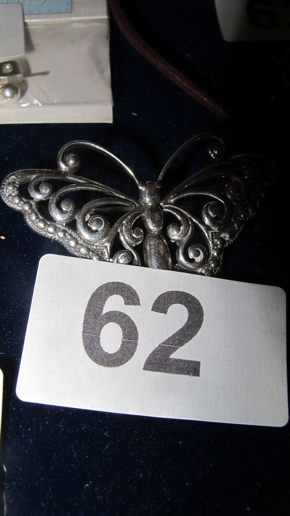Lot 62: Silver-Toned Openwork Scroll Butterfly Brooch