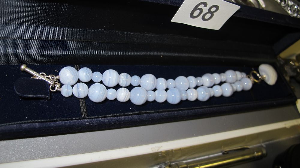 Lot 68: A Double Strand Blue Lace Agate Graduated Bead Necklace with Sterling Silver Toggle Clasp