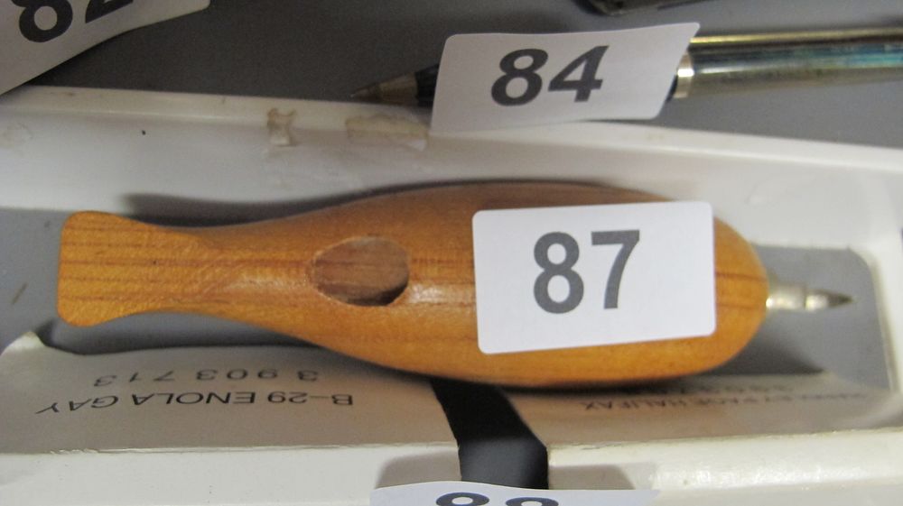 Lot 87: A Novelty Carved Teak Fish Ballpoint Pen and a Slim Metal Ballpoint Pen