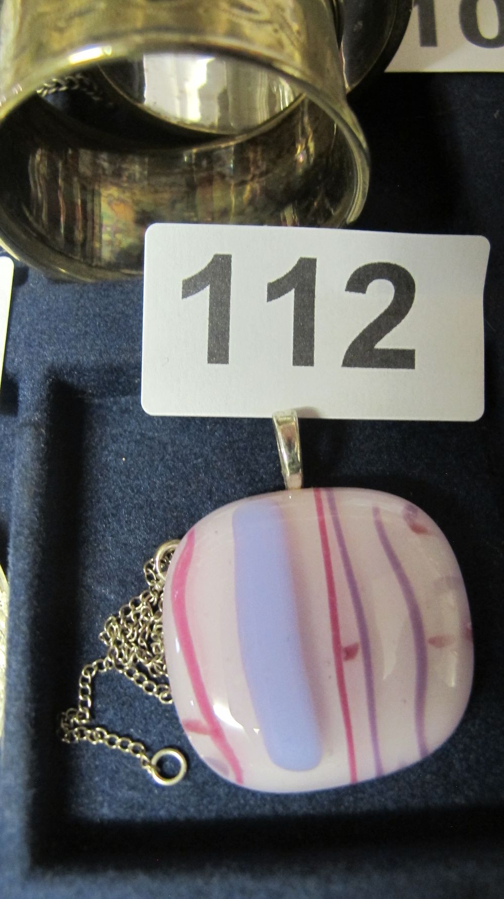 Lot 112: A Fused Studio Glass Pendant on a Fine Curb Link Chain