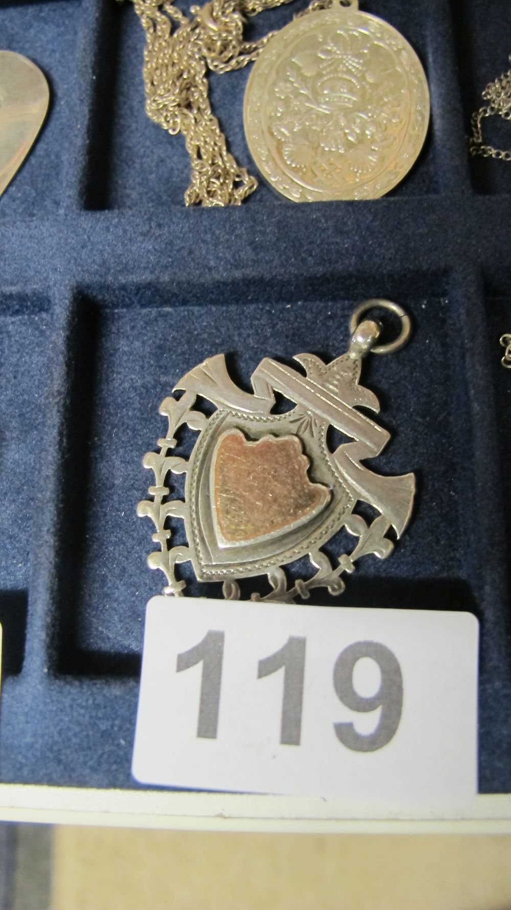 Lot 119: Edwardian Two Tone Sterling Silver and Rose Gold Shield Pendant Watch Fob