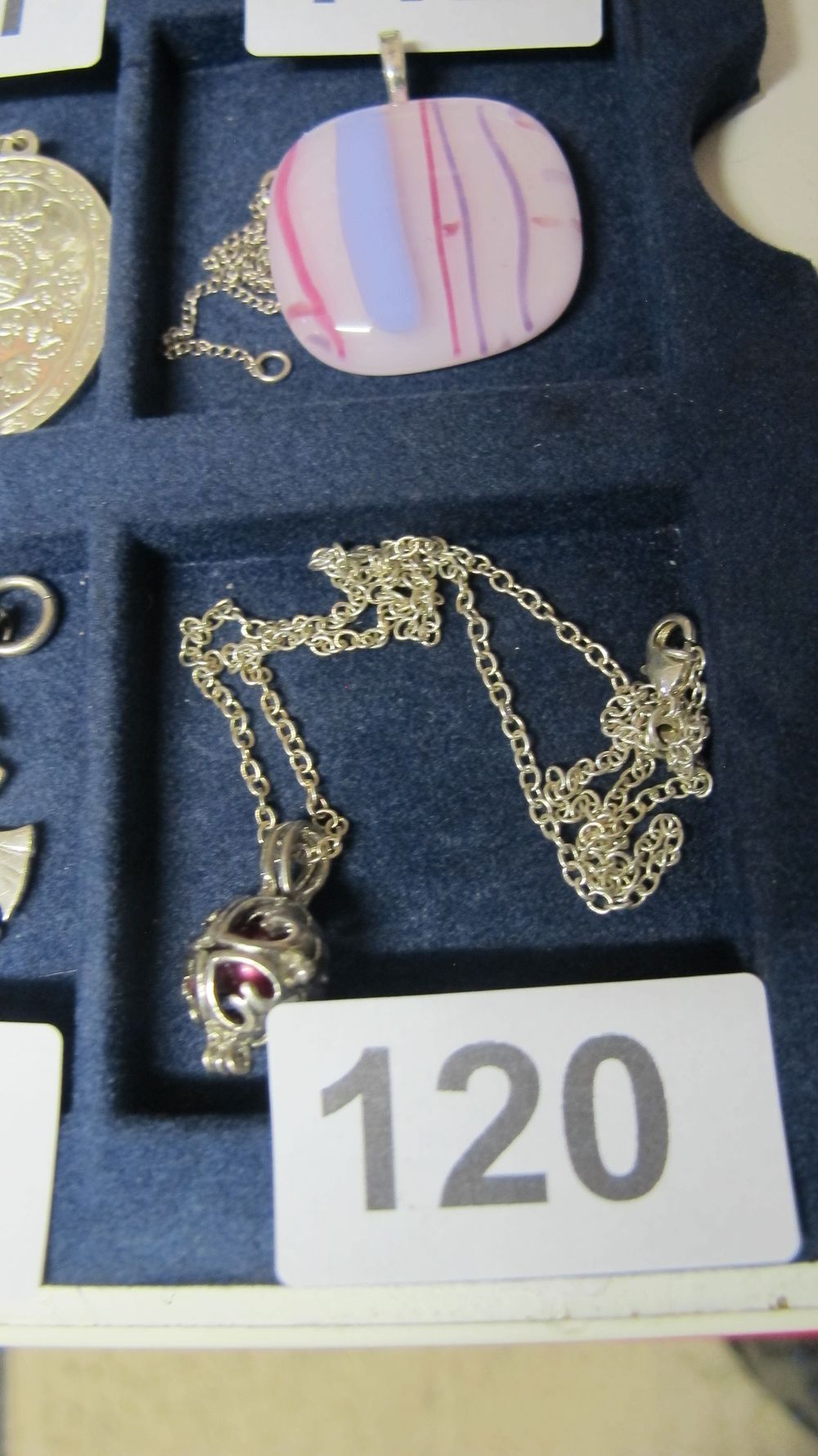 Lot 120: A White Metal Cage Pendant Necklace