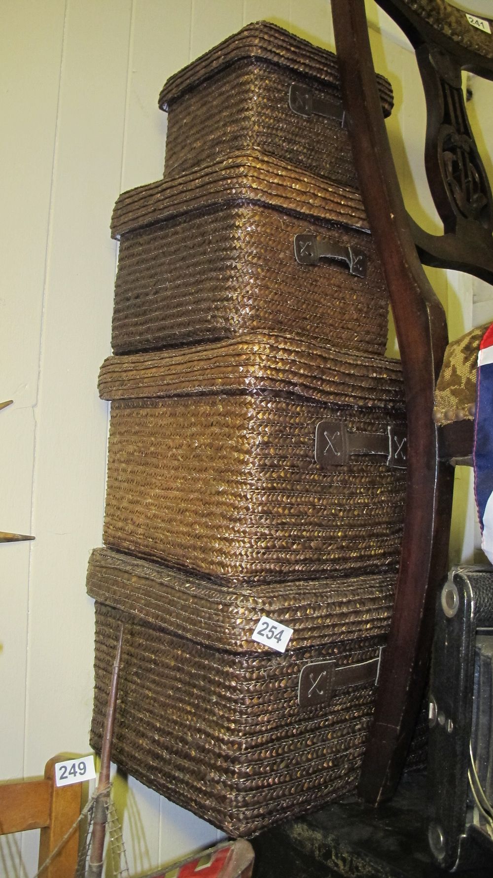Lot 254: A Collection of Woven Seagrass Nesting Storage Trunks