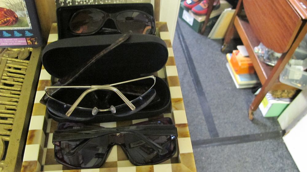 Lot 317: A Trio of Assorted Sunglasses with Two Protective Cases