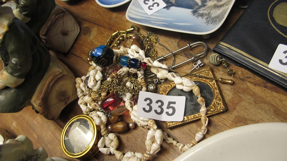 Lot 335: An Assortment of Costume Jewellery, Shell Necklaces, and Portrait Miniatures