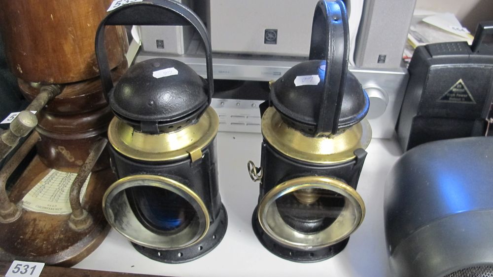 Lot 533: A Pair of Black-Painted Sheet Metal and Brass Railway Handlamps
