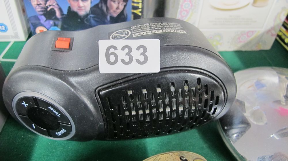 Lot 633: Compact Plug-In Electric Ceramic Space Heater