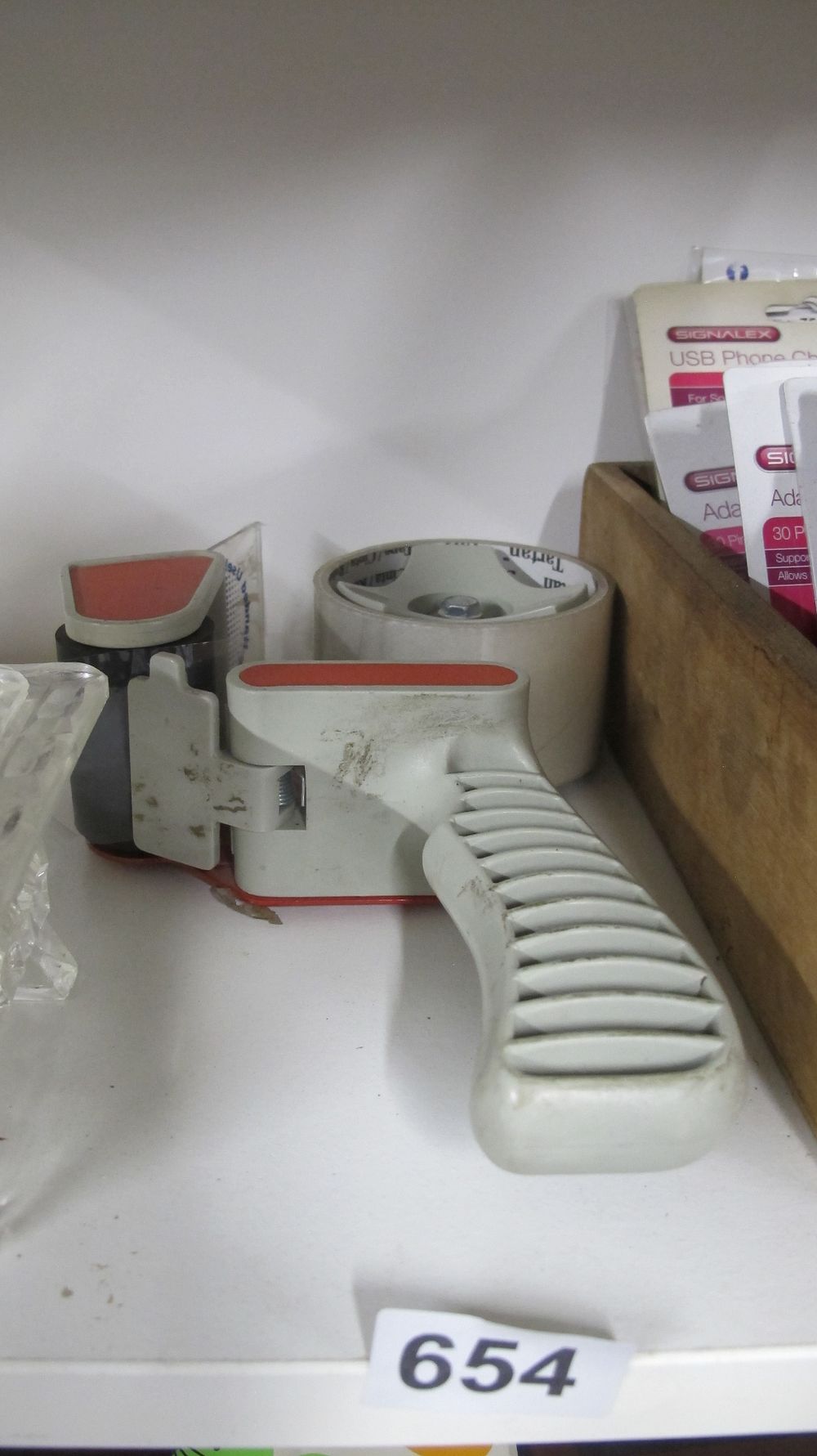 Lot 654: A Pistol Grip Packing Tape Dispenser with a Roll of Tartan Tape and a Collection of Signalex USB Phone Accessories