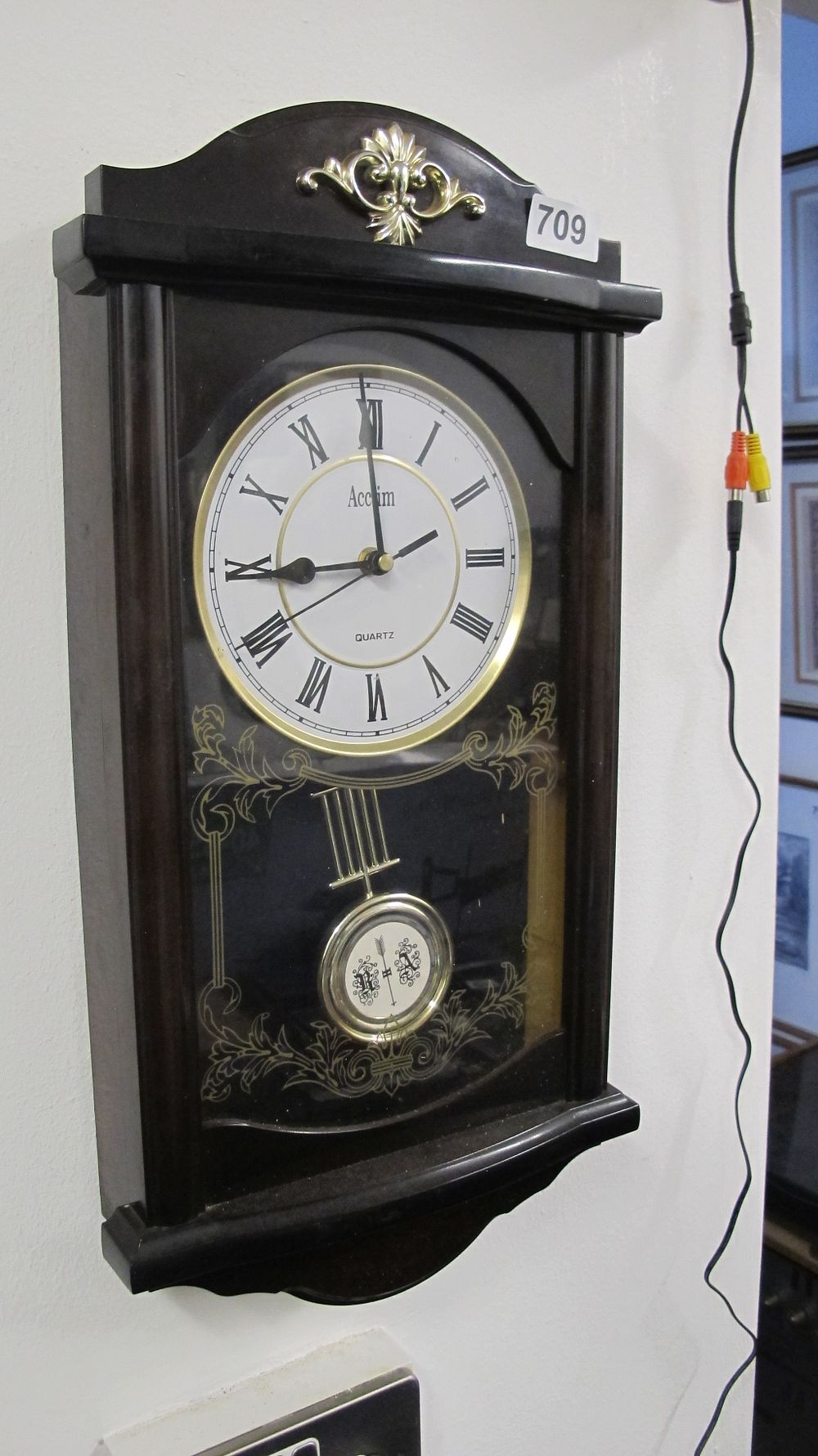 Lot 709: Acctim Quartz Wall Clock with Pendulum