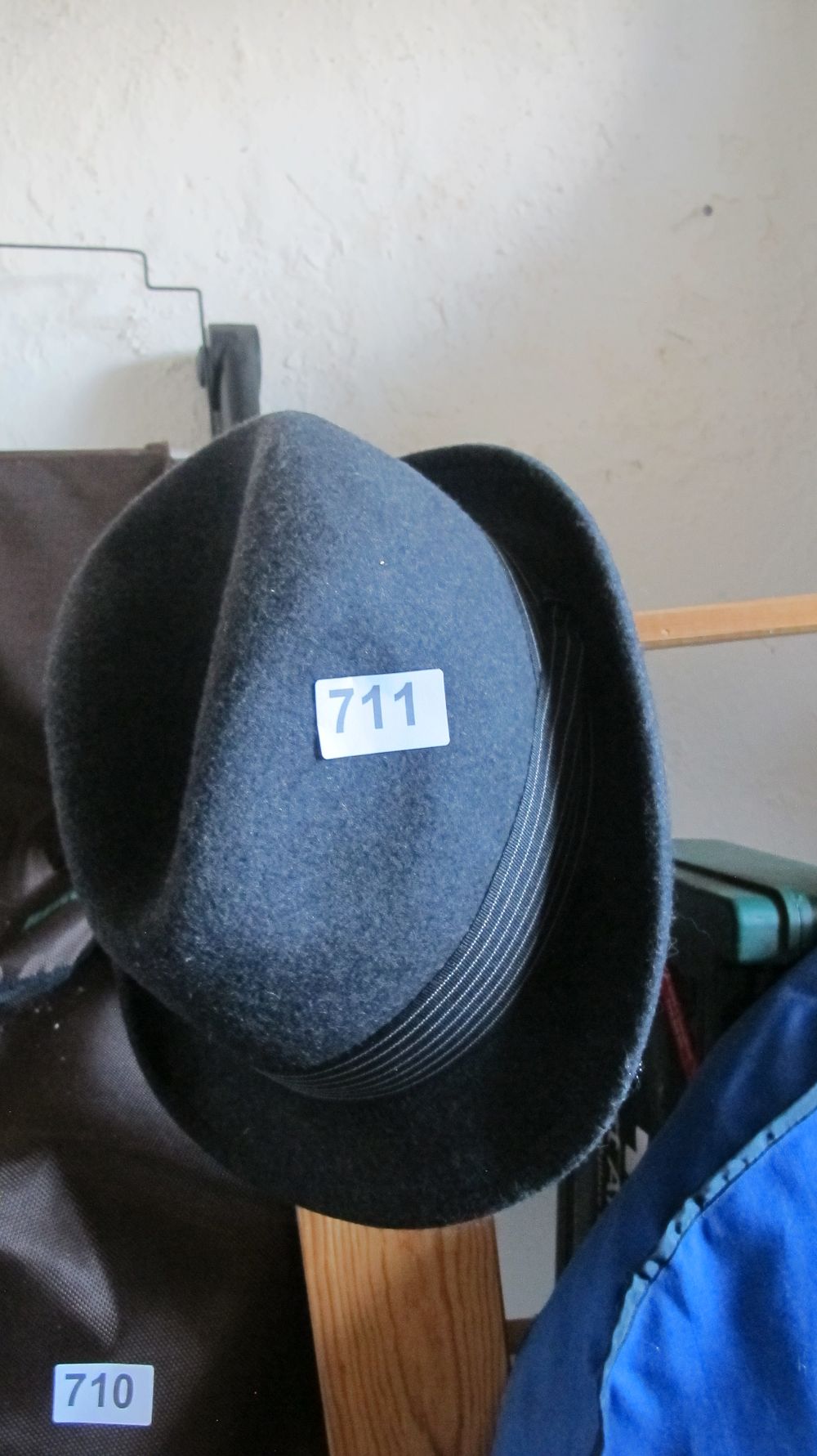 Lot 711: A Wool Felt Trilby Hat in Dark Blue