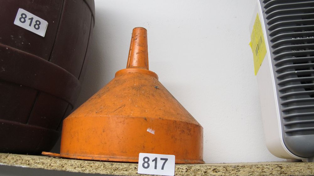 Lot 817: A Large Orange Plastic Workshop Funnel