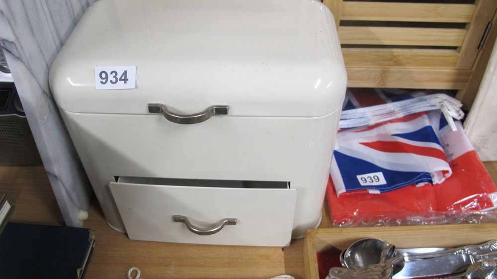 Lot 934: Two kitchen and storage items including a two-tier metal bread bin and Union Jack bunting