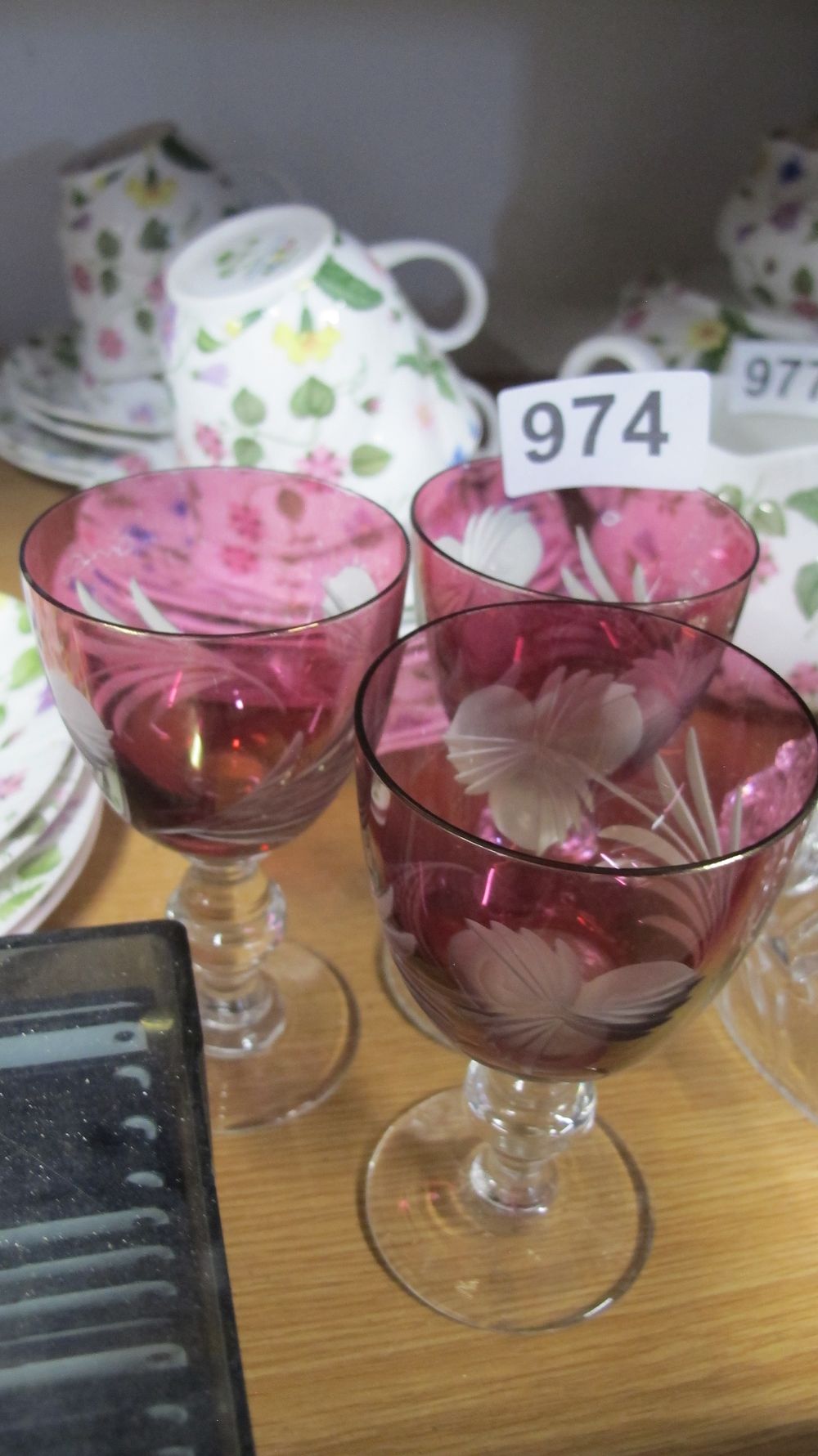 Lot 974: A Trio of Cranberry and Clear Glass Wine Goblets