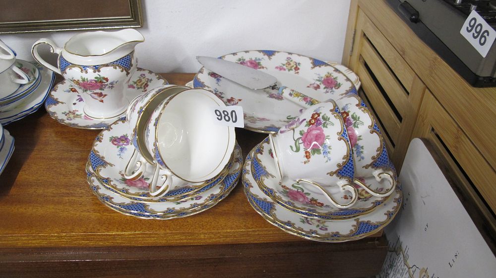 Lot 980: A Set of Gilt Edged and Floral Decorated Bone China Tea Ware