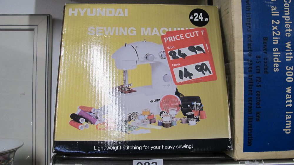 Lot 982: A Boxed Hyundai Portable Electric Sewing Machine with Accessories