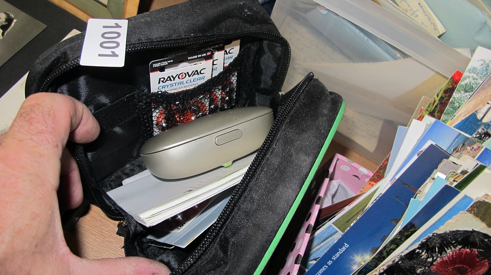 Lot 1001: An Assortment of Hearing Aid Equipment and Accessories including Rayovac Batteries and Charging Case