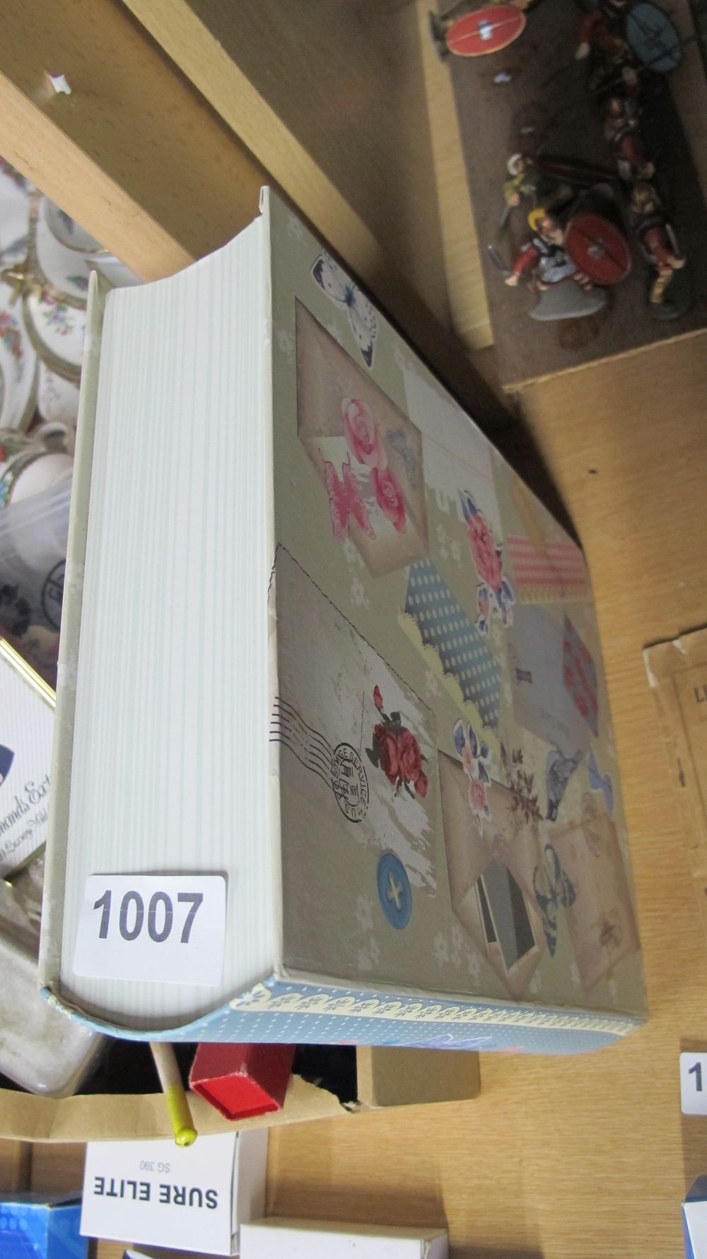 Lot 1007: A Decorative Book-Form Storage Box with Floral Decoupage Design