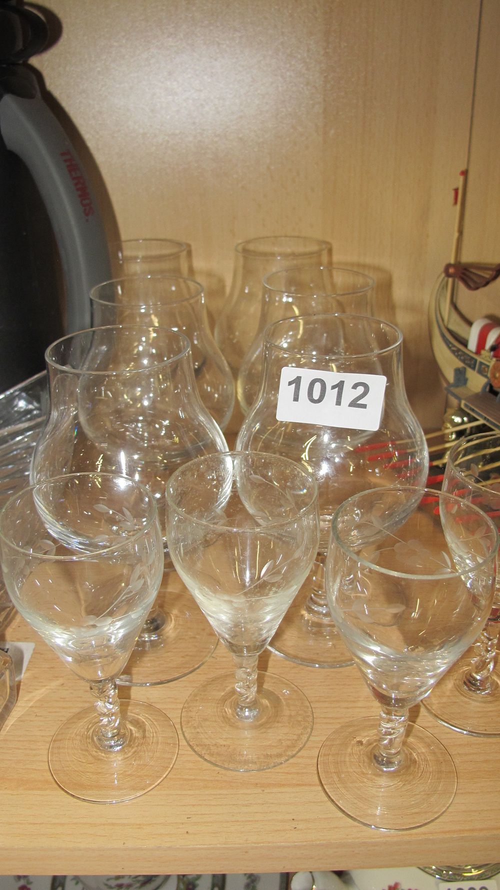 Lot 1012: A Group of Etched Wine Glasses and Hurricane Shades