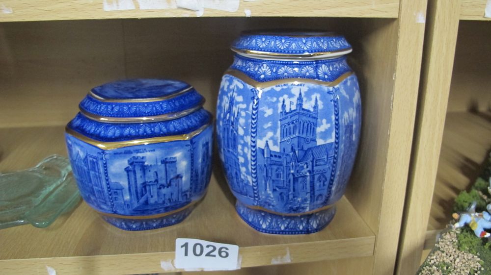Lot 1026: A Pair of Blue and White Gilt Accented Octagonal Ceramic Jars