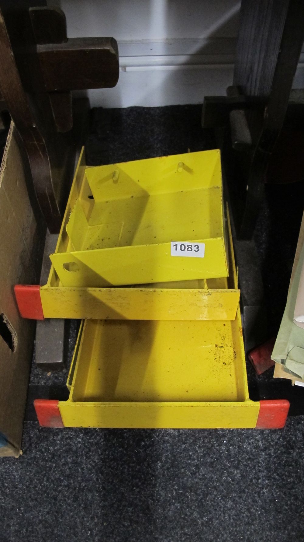 Lot 1083: A Pair of Yellow Painted Steel Industrial Wheel Chocks