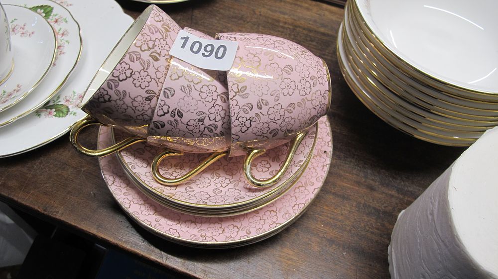 Lot 1090: A Group of Gilt Floral Pattern Pink Porcelain Tea Wares