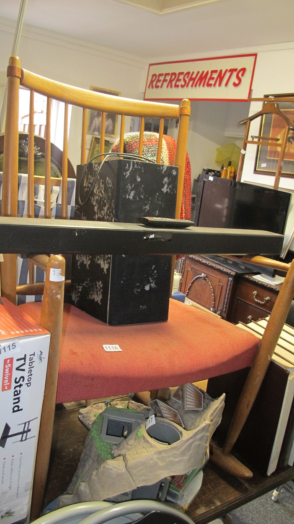 Lot 1116: An LG Soundbar and Wireless Subwoofer System with Remote and a Boxed AVA Tabletop TV Stand