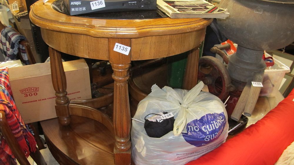 Lot 1135: A Circular Two Tier Oak Occasional Table with Inset Top