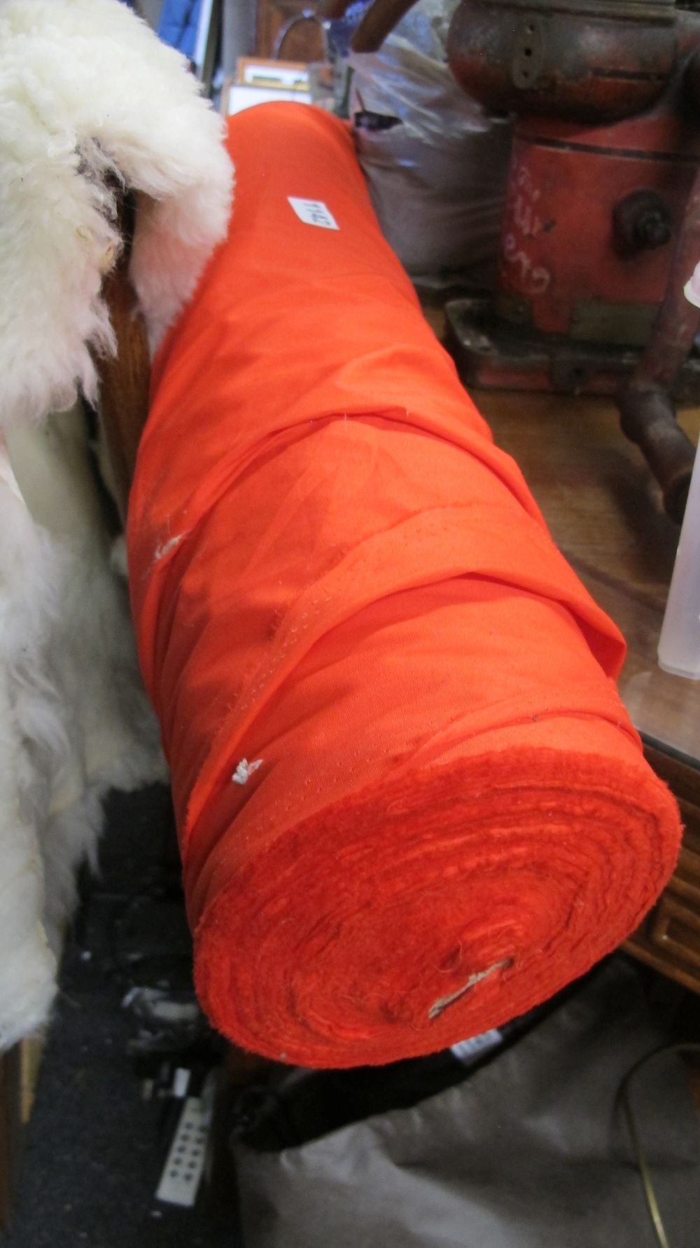 Lot 1142: A Bolt of Solid Bright Orange Plain Weave Fabric