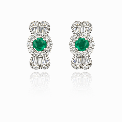 EMERALD AND DIAMOND EARRINGS. PAIR OF WHITE GOLD EARRINGS WITH 2 OVAL-CUT EMERGENCIES 6X5 MM 