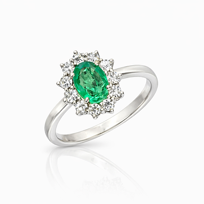 18K WHITE GOLD RING WITH EMERALD AND DIAMONDS. WHITE GOLD RING WITH 1.5CT OVAL COLOMBIAN 