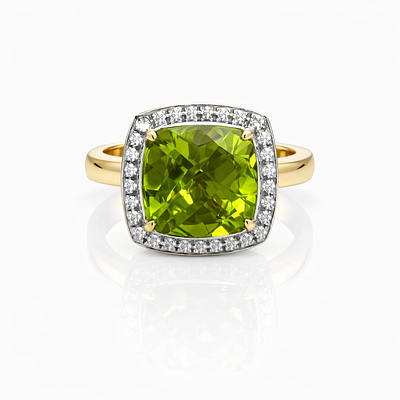 RING WITH PERIDOT AND DIAMONDS. 18KT YELLOW GOLD RING WITH PERIDOT AND 28 BRILLIANT CUT DIAMONDS 