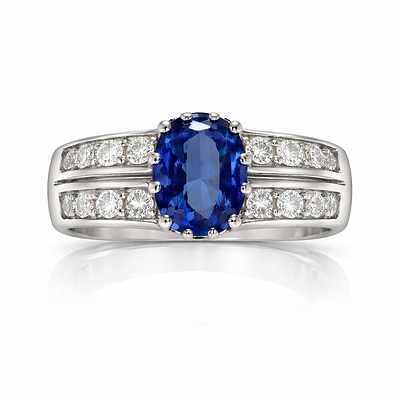 BEAUTIFUL TANZANITE SET IN A WHITE GOLD RING WITH EXCEPTIONAL COLORED DIAMONDS. WHITE GOLD RING 