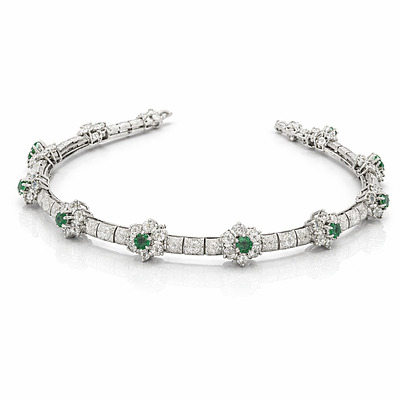 RIGID ARTICULED BRACELET WITH DIAMONDS AND EMERALDS. 18KT WHITE GOLD BRACELET WITH BRILLIANT CUT 